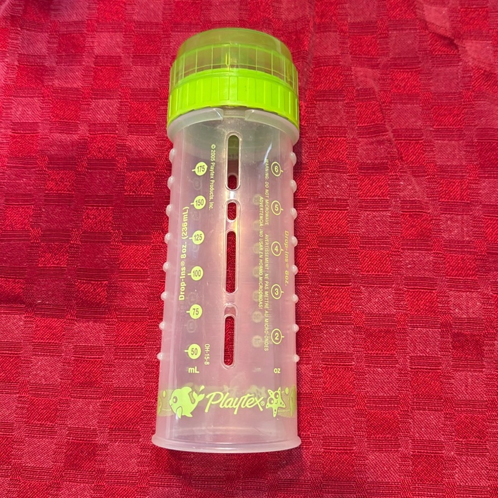 Green Playtex drop-in baby bottle